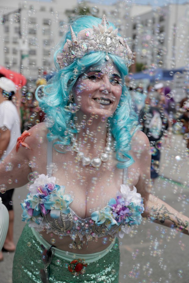 Paradegoers dressed in all types of aquatic themed costumes, march and perform in the 43rd Annual Coney Island Mermaid Parade in Brooklyn New York on June 21, 2025. (Photo by Andrew Schwartz)