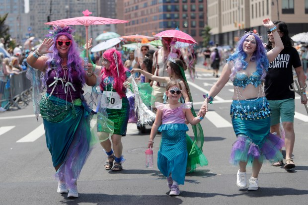 Paradegoers dressed in all types of aquatic themed costumes, march and perform in the 43rd Annual Coney Island Mermaid Parade in Brooklyn New York on June 21, 2025. (Photo by Andrew Schwartz)