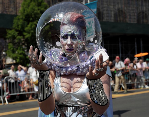 Paradegoers dressed in all types of aquatic themed costumes, march and perform in the 43rd Annual Coney Island Mermaid Parade in Brooklyn New York on June 21, 2025. (Photo by Andrew Schwartz)
