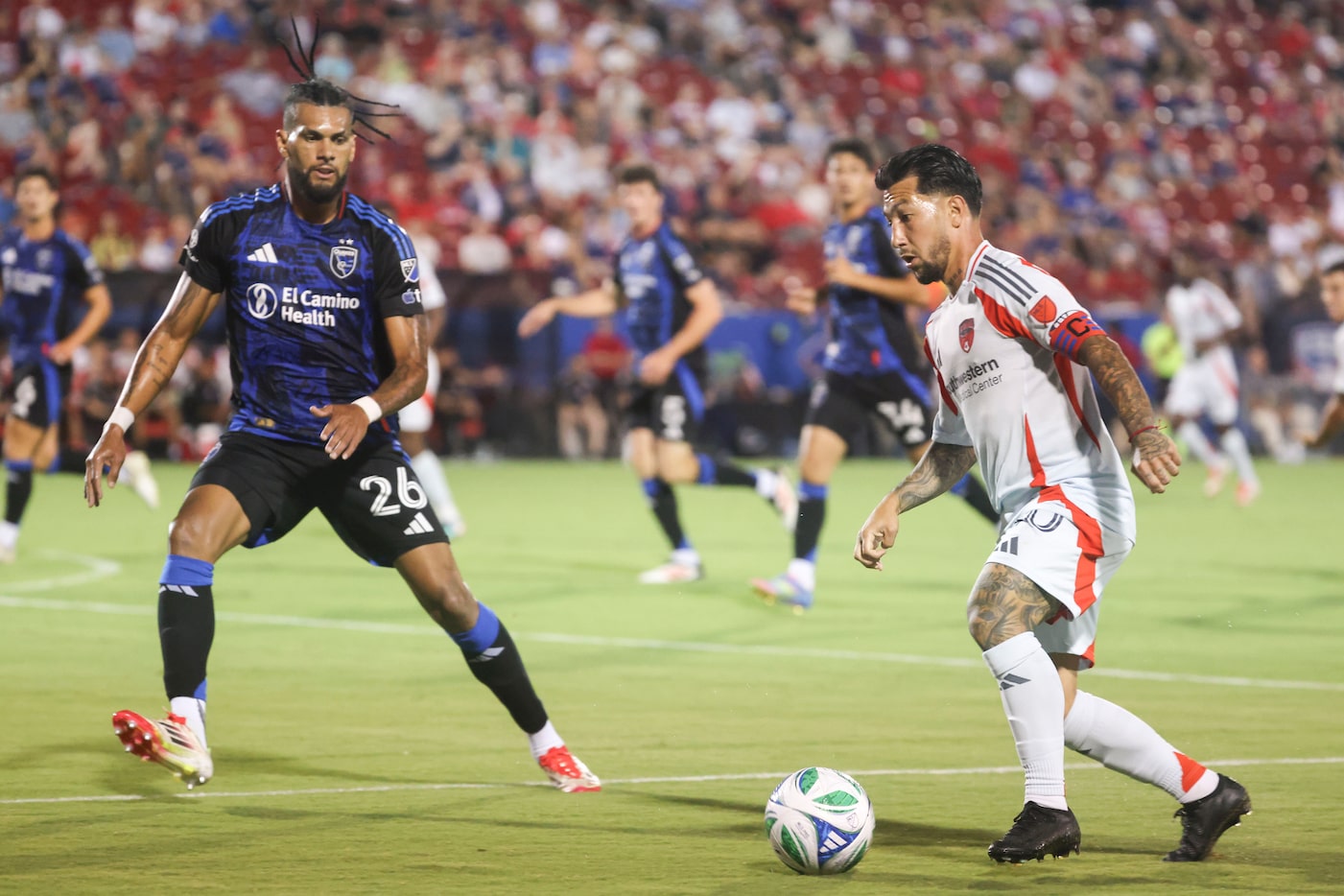 San Jose Earthquakes defender Rodrigues (26) follows as FC Dallas midfielder Luciano Acosta...