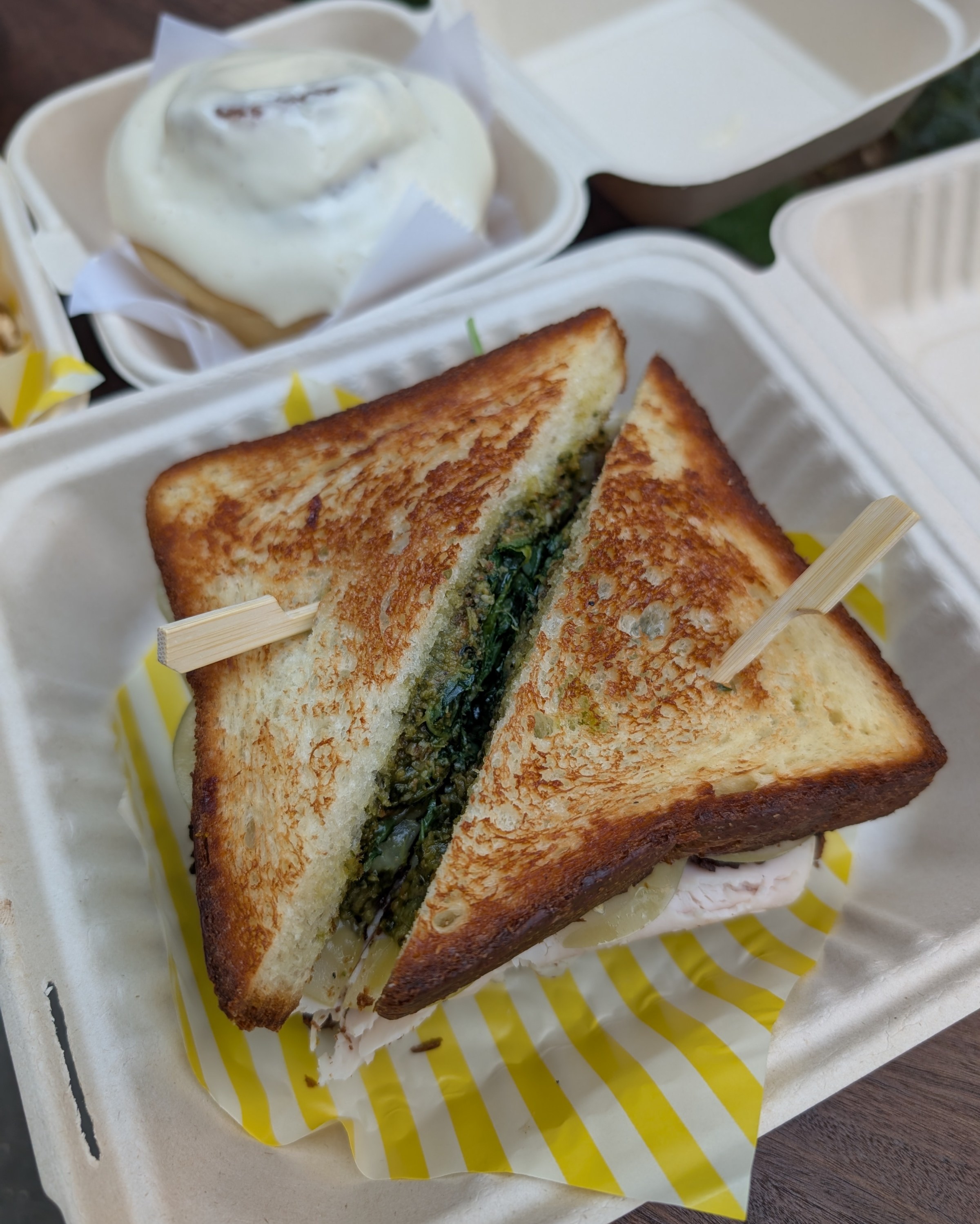A halved sandwich in a container.