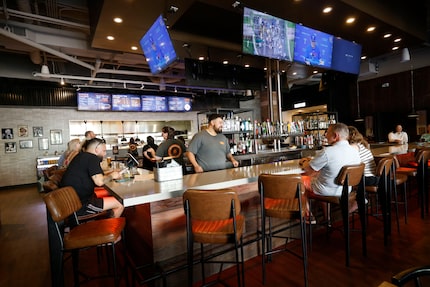 Shoals Smokehouse has barbecue on the menu, drinks at the bar.