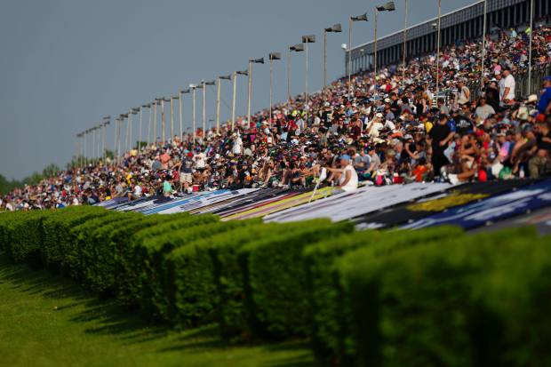 Fans look on from the grandstands during a NASCAR Cup...