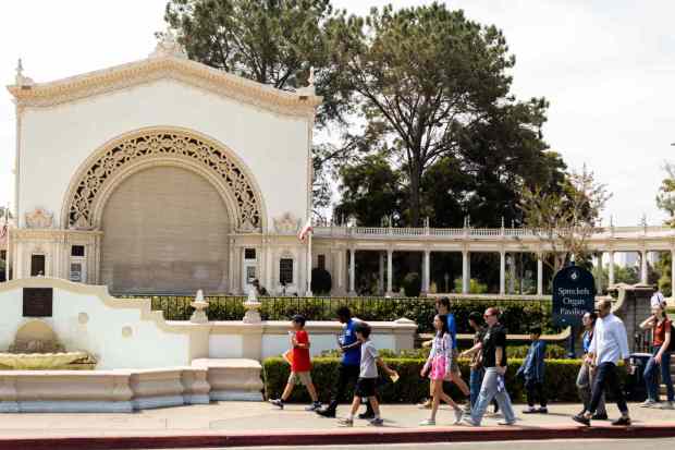 Visitors walk past the Spreckels Organ Pavilion at Balboa Park. (Brittany Cruz-Fejeran / The San Diego Union-Tribune)