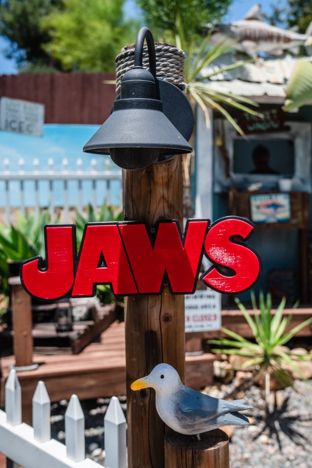 A “Jaws” sign welcomes visitors to the outdoor movie theater...