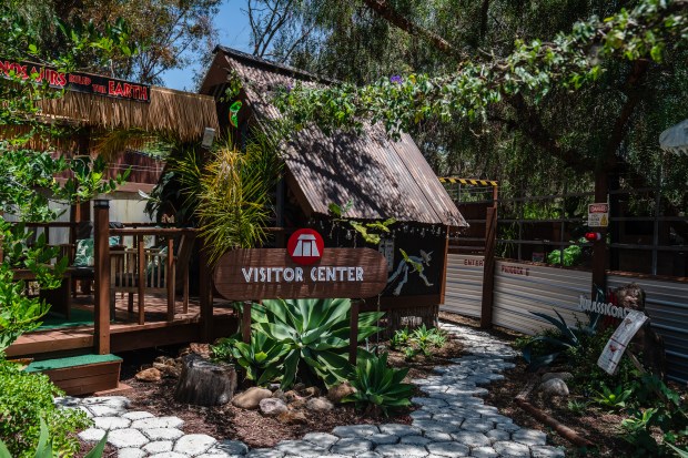 A visitor center greets spectators in the "Jurassic World"-inspired area...