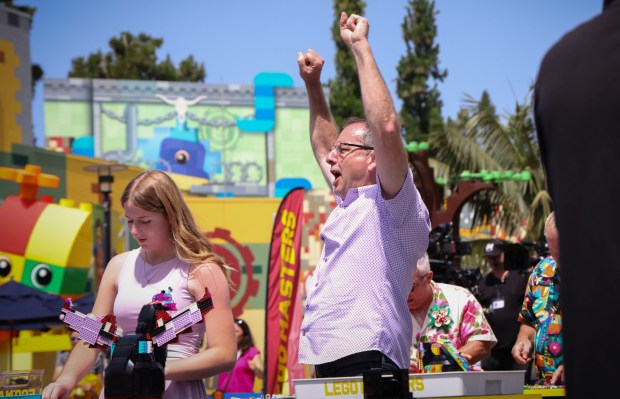 Mike Sanborne cheers during the Lego Masters competition at Legoland California on Sunday, June 22, 2025 in Carlsbad. The popular TV show features teams of Two building Lego projects from a vast array of bricks and parts to meet both creative and practical goals set by the challenge for a particular episode. About 100 contestants competed (Photo by Sandy Huffaker for The San Diego Union-Tribune)