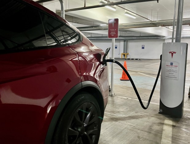 A Tesla fast-charging station at an indoor parking lot on the corner of Sixth Avenue and A Street in downtown San Diego. Photo taken June 25, 2025. (Rob Nikolewski/The San Diego Union-Tribune)