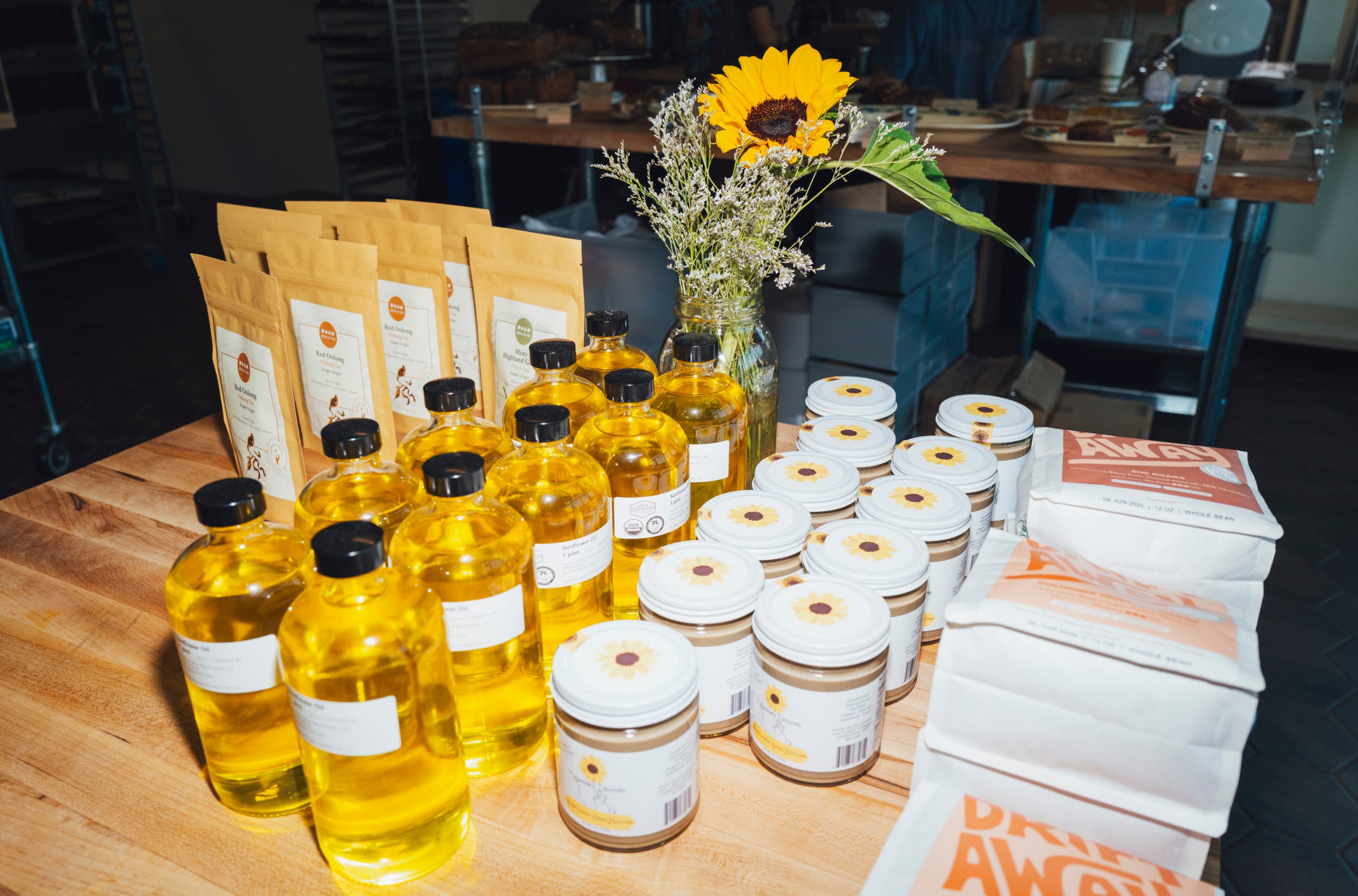 A table with yellow clear bottles and jars.