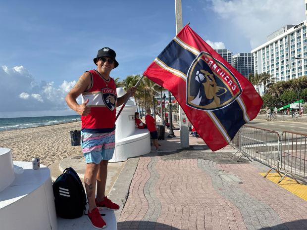 Davie resident Esteban Medel, 43, was in position at the Bayshore Drive entrance to Fort Lauderdale beach at 7 a.m. Sunday, five hours before the start of the Florida Panthers Stanley Cup championship parade. (Kari Barnett/South Florida Sun Sentinel)