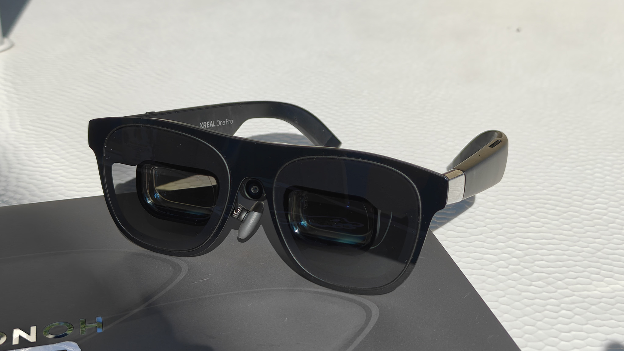 Xreal One Pro smart glasses with an Xreal Eye camera attached