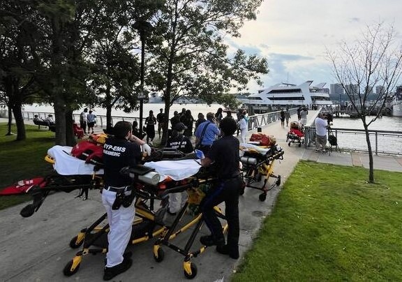 Medics were on hand to treat passengers who were injured by the unexpected crash into the dock. (Julian Roberts-Grmela / New York Daily News)