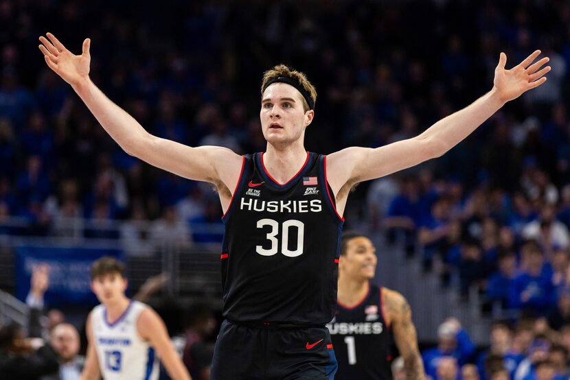 UConn forward Liam McNeeley (30) celebrates during the second half of an NCAA college...