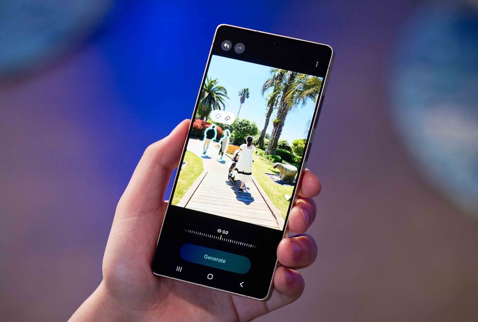 a hand holding the galaxy s25 ultra while it prepares a generative edit