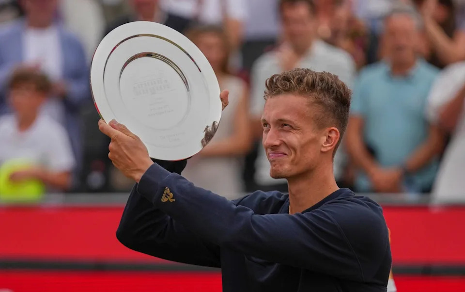 Jiri Lehecka of the Czech Republic hold up the runners-up plate