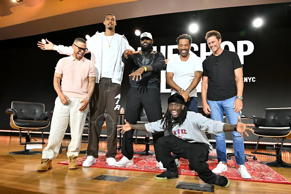 NEW YORK, NEW YORK - JUNE 21:  (L-R) Paul Rivera, Victor Wembanyama, LeBron James, Maverick Carter, Tom Brady and Kai Cenat speak onstage at Fanatics Fest NYC 2025 at Javits Center on June 21, 2025 in New York City. (Photo by Slaven Vlasic/Getty Images)