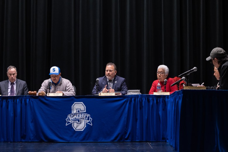 The Somerset ISD board of trustees meets inside of the Somerset High School Performing Arts Center Monday.