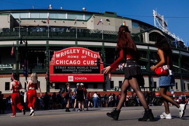 Fans walk outside Wrigley Field before Stray Kids perform, June 26, 2025, in Chicago. Stray Kids are the first K-pop band to perform at Wrigley Field. (Armando L. Sanchez/Chicago Tribune)