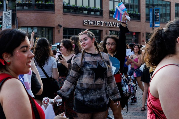 Fans take photos outside Wrigley Field before Stray Kids perform, June 26, 2025, in Chicago. (Armando L. Sanchez/Chicago Tribune)