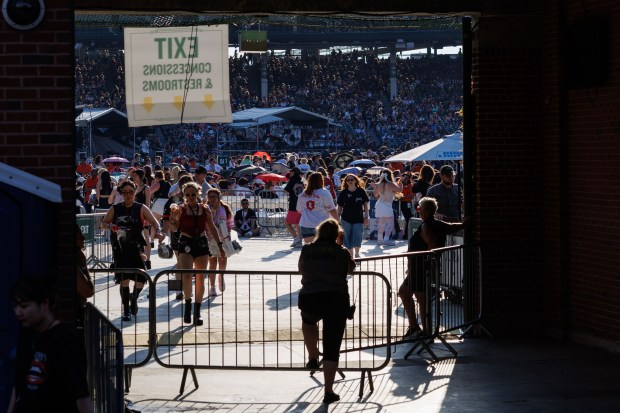 A person stands near a field entrance before Stray Kids perform at Wrigley Field, June 26, 2025, in Chicago. (Armando L. Sanchez/Chicago Tribune)