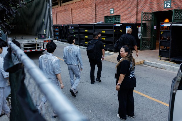 Members of Stray Kids walk to the stadium before performing at Wrigley Field, June 26, 2025, in Chicago. (Armando L. Sanchez/Chicago Tribune)