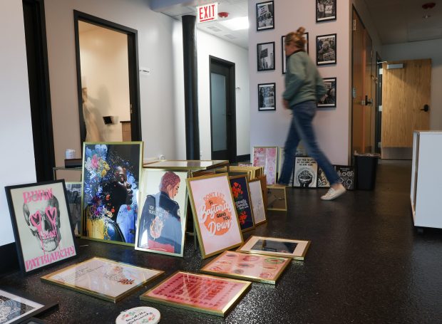 Art work is lined up ready to be hung as staff members (NOTE all of the people shown here are fine with being identifiable and named) walk through Hope Clinic Chicago on May 28, 2025, in Chicago. Hope Clinic Chicago is set to open in early June. They will be the only all term abortion clinic in the midwest. (Stacey Wescott/Chicago Tribune)