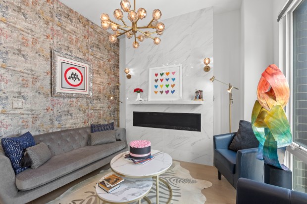 The condo at 2773 Hampden Court, Unit PH03, in Lincoln Park, has a rooftop deck with an outdoor kitchen and murals on two of the terrace walls. (Kurt Cichowski)