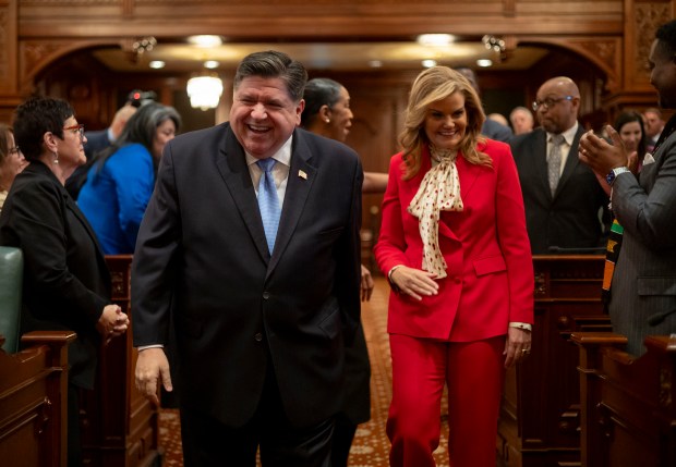Gov. JB Pritzker arrives with wife MK Pritzker to deliver his annual State of the State address, Feb. 19, 2025, at the Illinois State Capitol in Springfield. (Brian Cassella/Chicago Tribune)