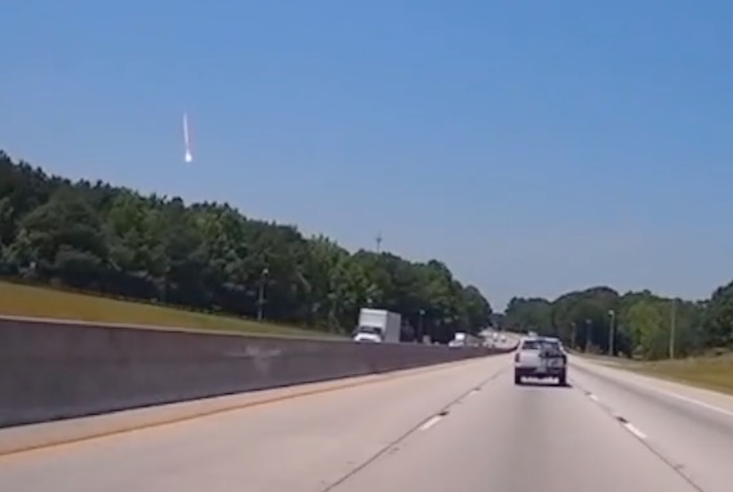 Dashcam footage of a fireball streaking across the sky.