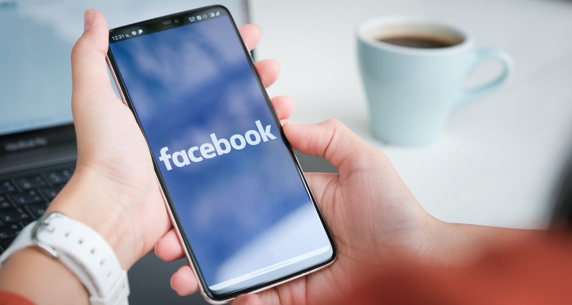 Facebook logo on a phone display