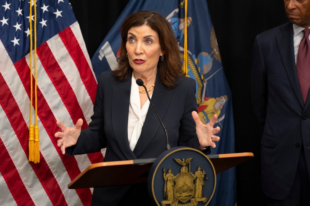 Governor Hochul speaking at a podium.