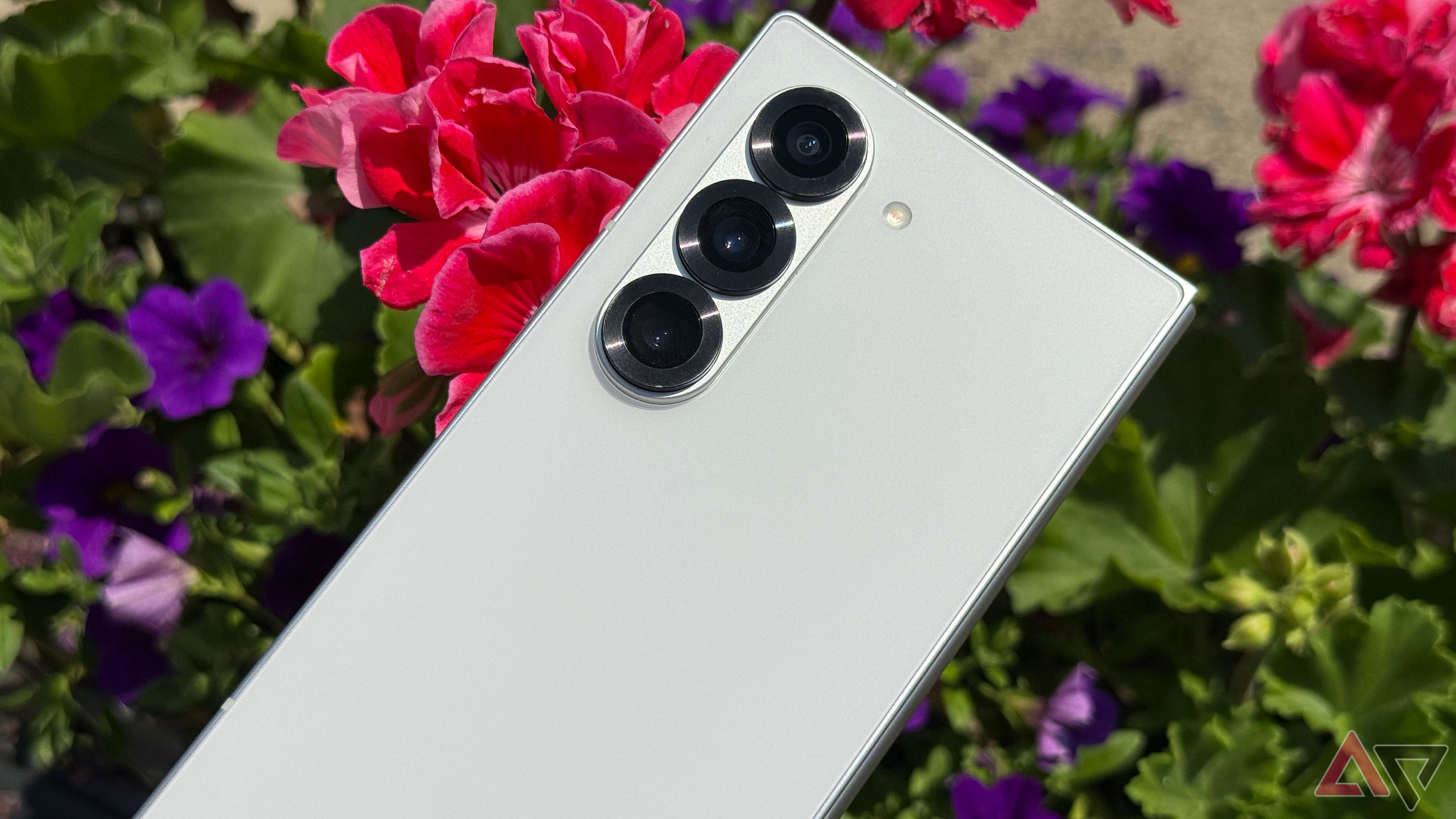 The Samsung Galaxy Z Fold 6 set against some flowers