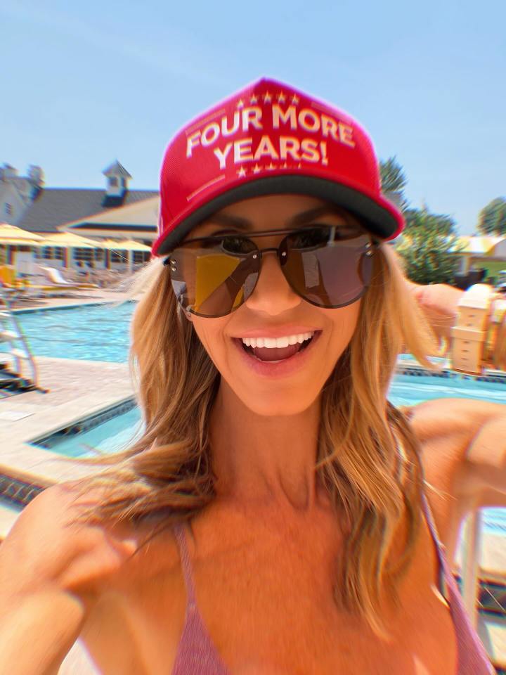 Lara Trump wearing a "Four More Years!" hat by a pool.
