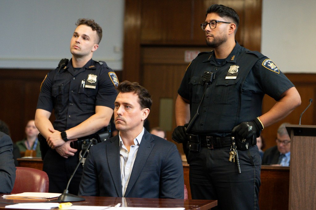 Mark Harris, a Manhattan banker, in court with two NYPD officers.