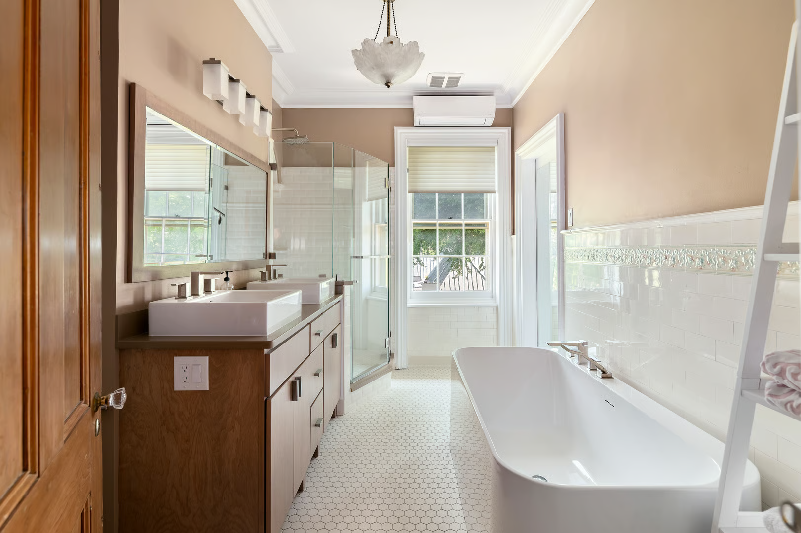 bathroom with tub and a corner shower