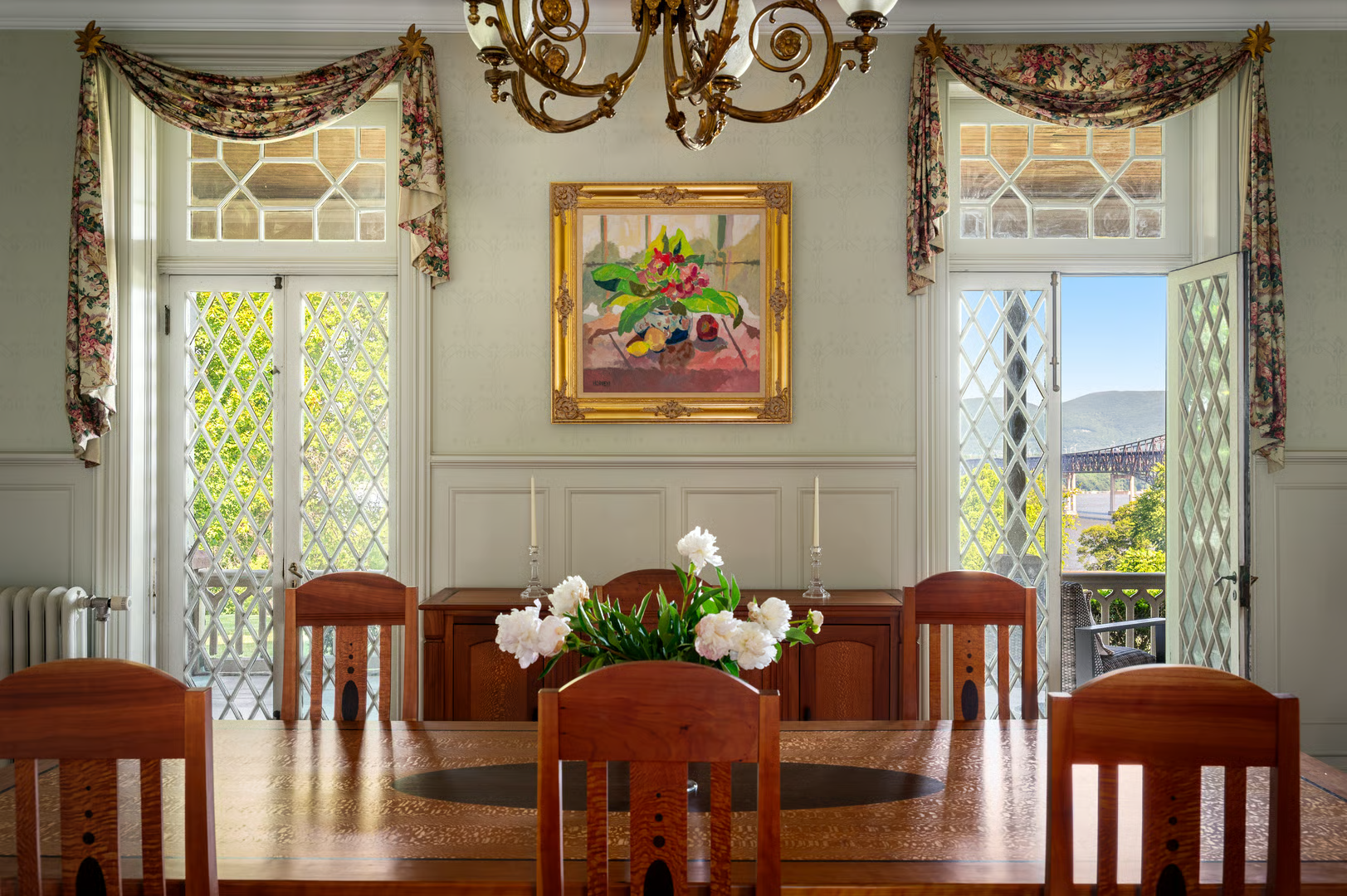 dining room with sage green walls and wainscoting
