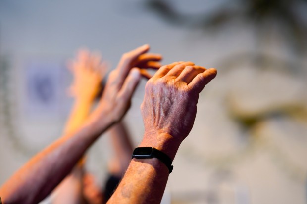During the NeuroDance class, 72-year-old Ron Weidner worked on hand and finger exercises with his wife and primary caregiver, Kitty Weidner. Weidner, a former home painting contractor, retired after later being diagnosed with Parkinson's disease.  (Nelvin C. Cepeda / The San Diego Union-Tribune)