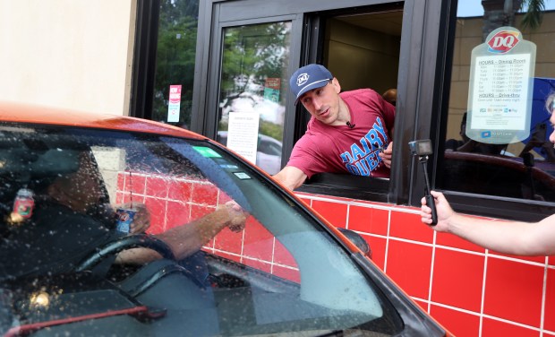 Panthers star Brad Marchand serves up “The Brad Blizzard” at a Dairy Queen drive thru in Sunrise on Friday, June 20, 2025. (Carline Jean/South Florida Sun Sentinel)