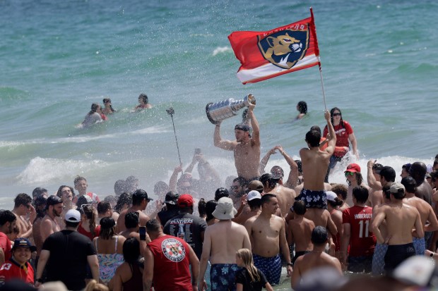 Fans celebrate at Fort Lauderdale beach as the Florida Panthers' 2025 Stanley Cup victory parade got under way on Sunday, June 22, 2025. (Mike Stocker/South Florida Sun Sentinel)