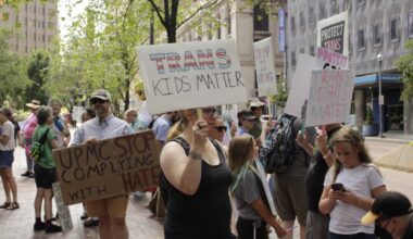 Advocates rally in support of trans health care in front of UPMC building 