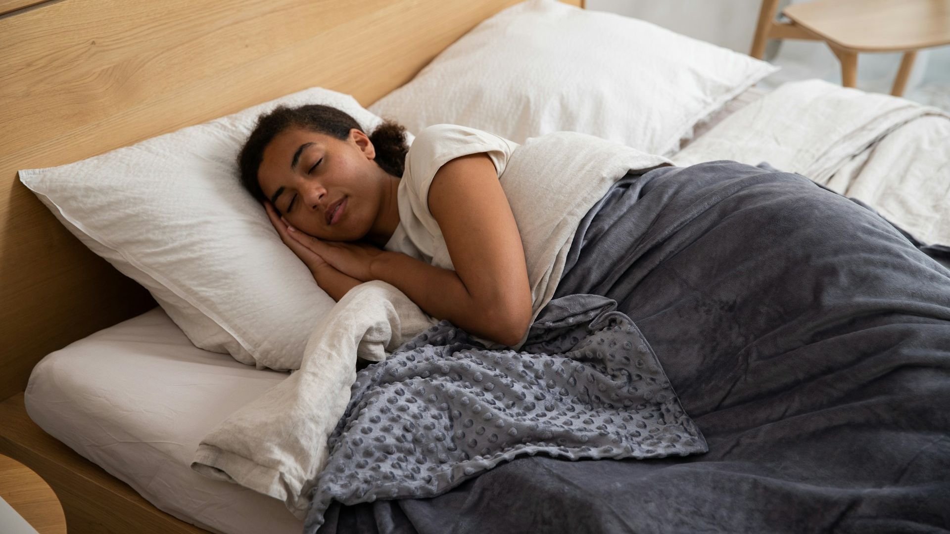 A woman sleeping on a bed