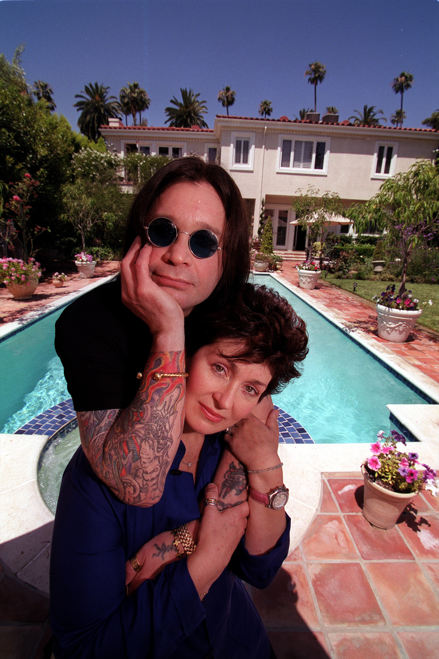 Ozzy and Sharon Osbourne by their Beverly Hills pool.