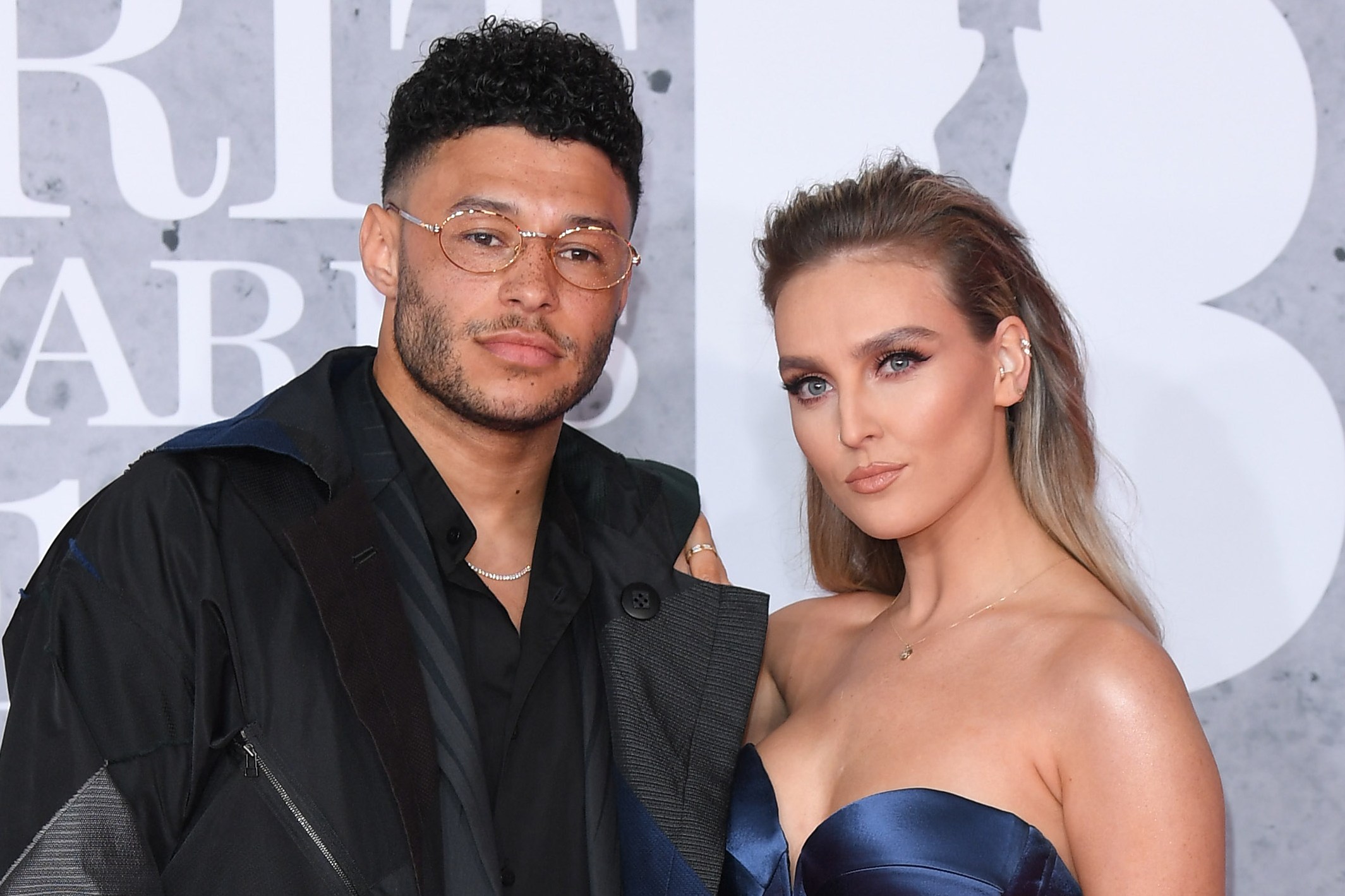 Alex Oxlade-Chamberlain and Perrie Edwards at the BRIT Awards 2019.