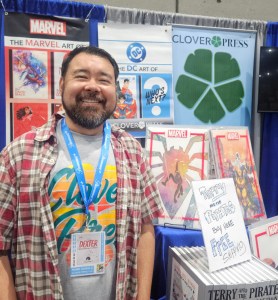 Comics publisher publisher Hank Kanalz in front of his company's booth.