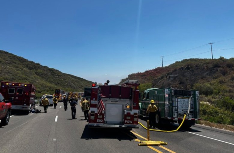 Fire trucks on state Route 67 after a collision that killed 5 people.
