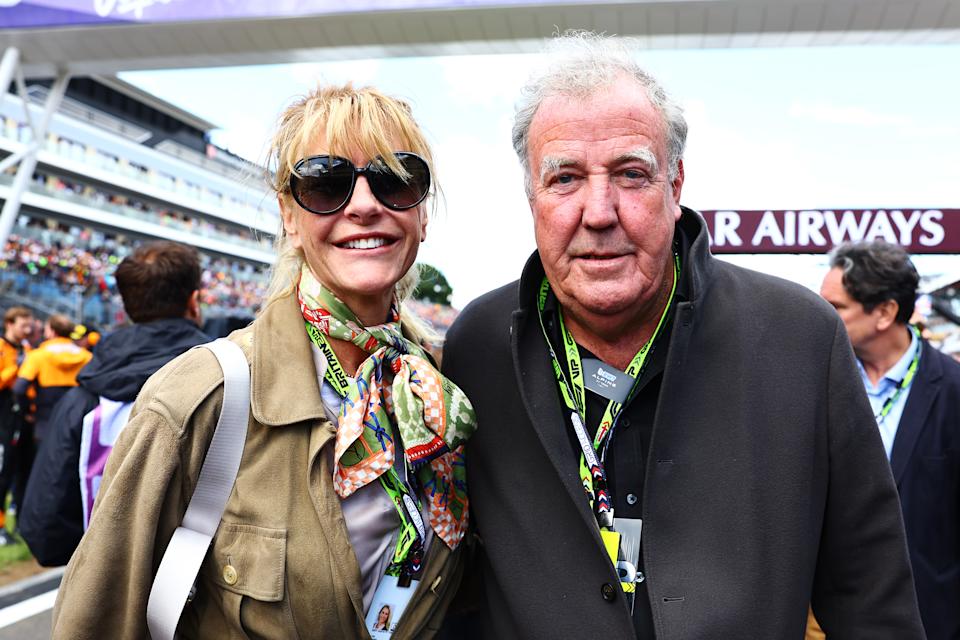 Lisa Hogan and Jeremy Clarkson pose for a photo on the grid during the F1 Grand Prix. 