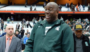 Mar 29, 2015; Syracuse, NY, USA; Michigan State Spartans former player Magic Johnson celebrates after the game against the Louisville Cardinals in the finals of the east regional of the 2015 NCAA Tournament at Carrier Dome. The Michigan State Spartans won 76-70.Mandatory Credit: Rich Barnes-Imagn Images