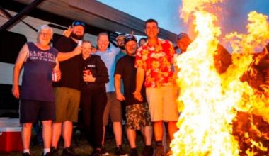 A group of campers enjoy their campsite at New Hampshire Motor Speedway in June 2024.