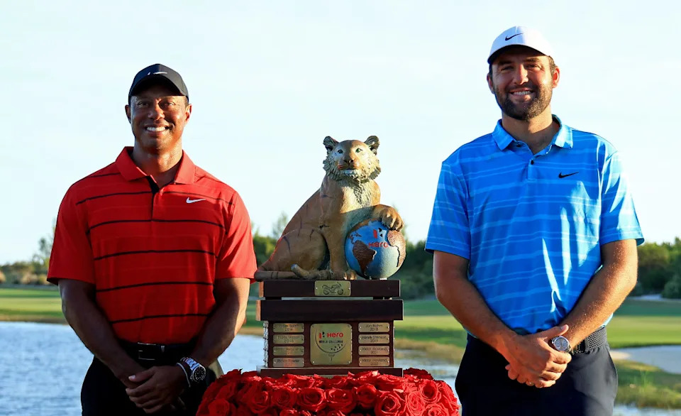 NASSAU, BAHAMAS - DECEMBER 03: Scottie Scheffler of the United States and tournament host Tiger Woods pose with the trophy after winning the final round of the Hero World Challenge at Albany Golf Course on December 03, 2023 in Nassau, . (Photo by Mike Ehrmann/Getty Images,)Mike Ehrmann&sol;Getty Images
