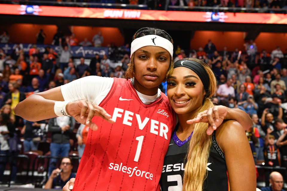 NaLyssa Smith (#1, Indiana Fever) and DiJonai Carrington (#21, Connecticut Sun) at a WNBA playoff game.